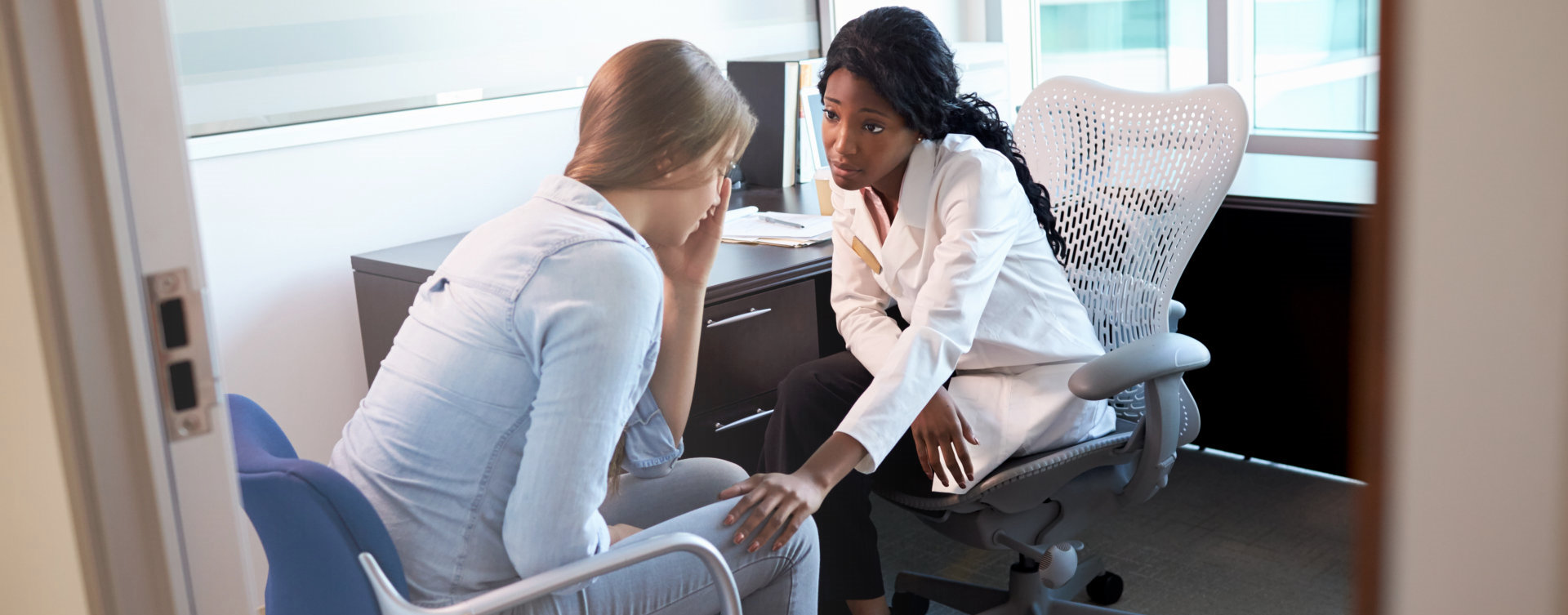 stressed woman accompanied by her friend